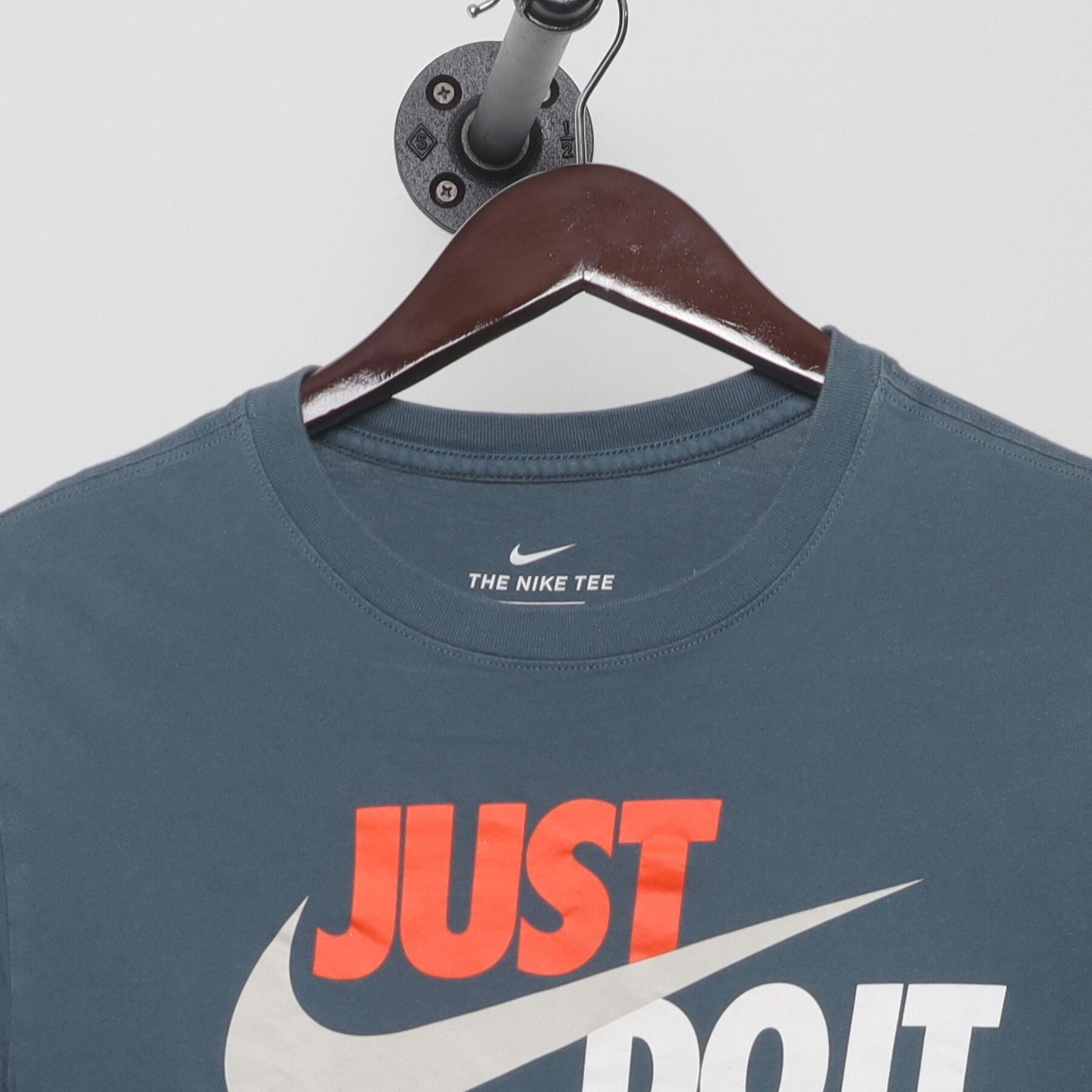 Close-up of the collar and tag on the Vintage 2010s Nike "Just Do It" T-Shirt - S