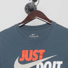 Close-up of the collar and tag on the Vintage 2010s Nike "Just Do It" T-Shirt - S