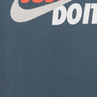 Close-up of the main graphic on the Vintage 2010s Nike "Just Do It" T-Shirt - S