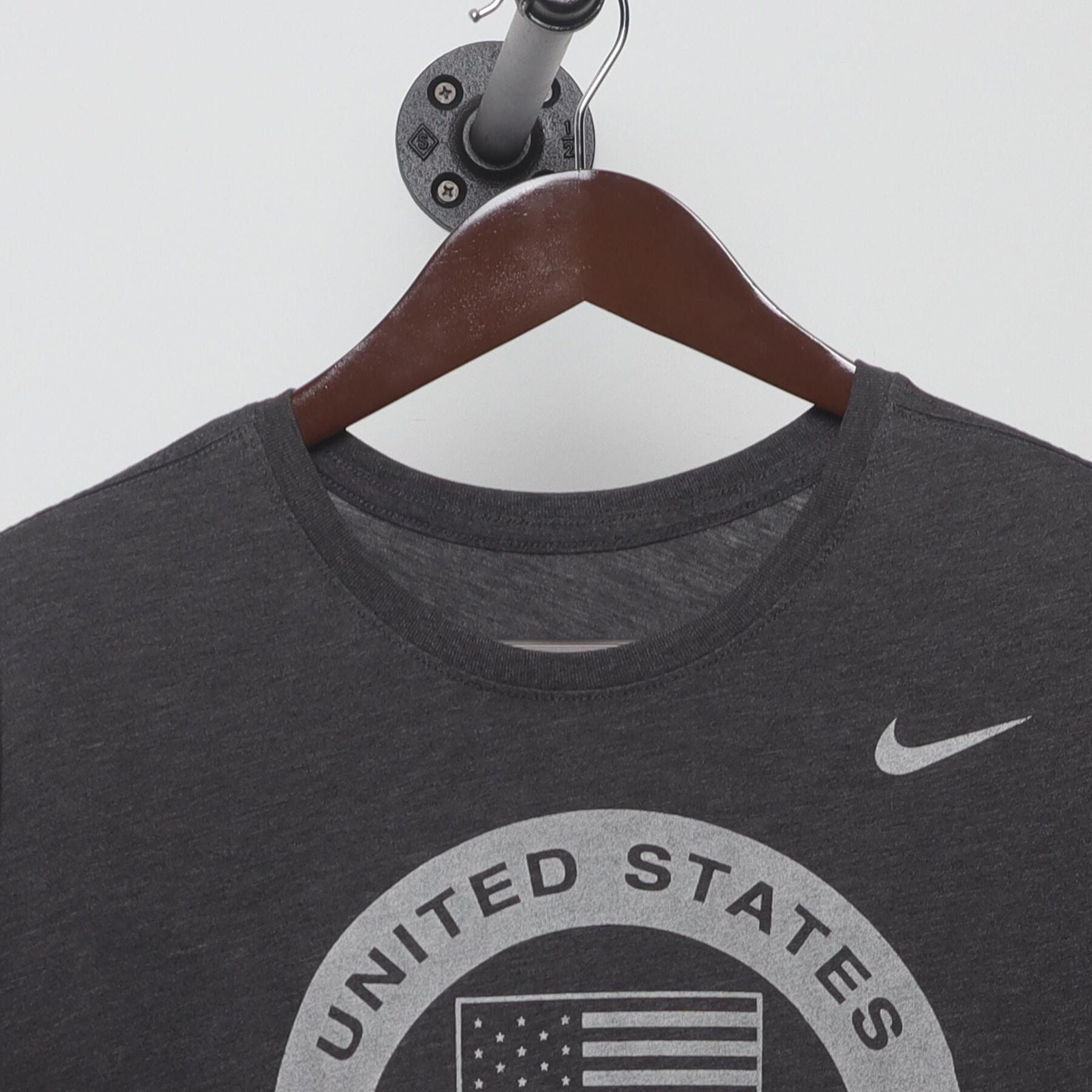 Close-up of the collar and tag on the Vintage Y2K Nike "United States Olympic Team" T-Shirt - L