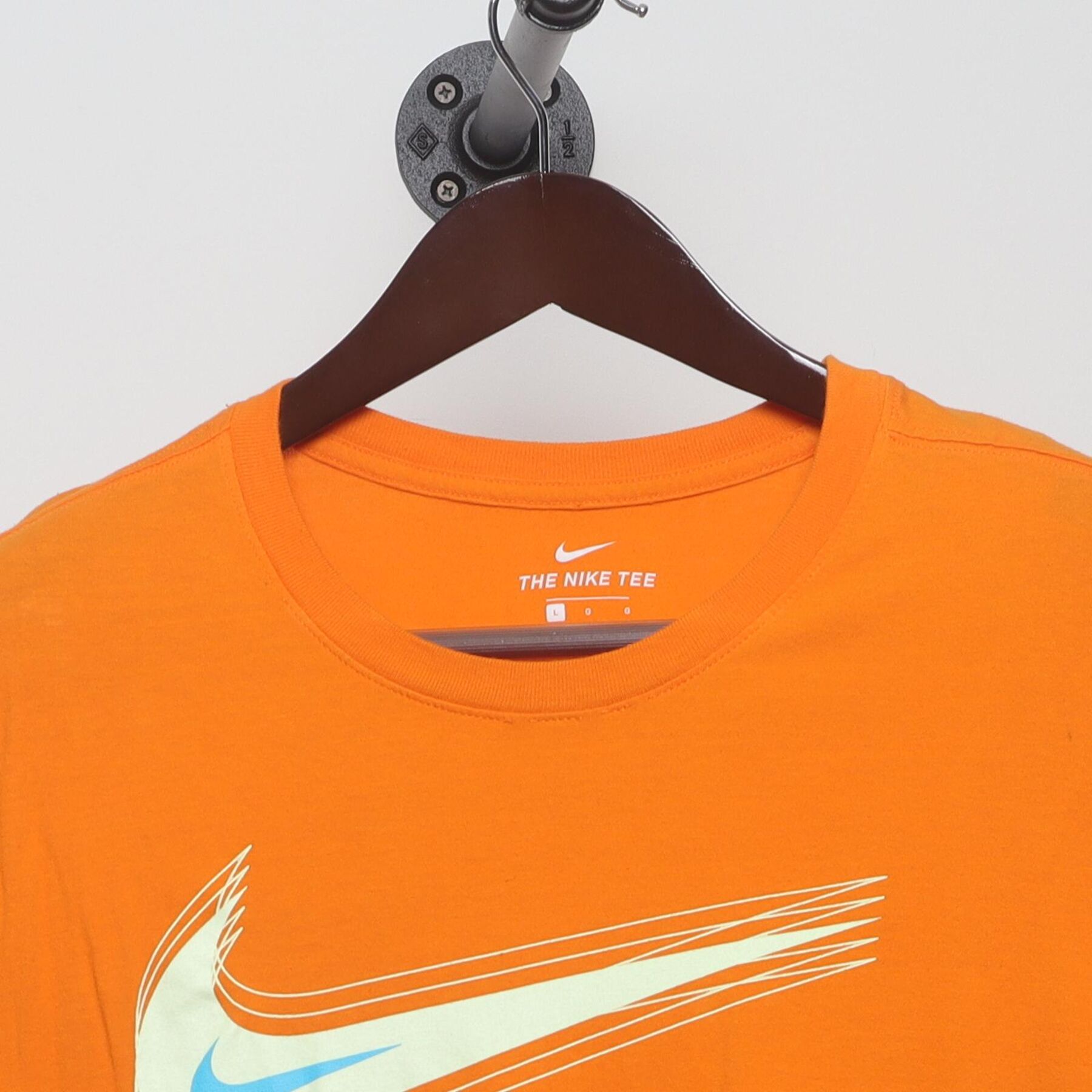 Close-up of the collar and tag on the Vintage 2010s Nike "Motion Swoosh" T-Shirt - M