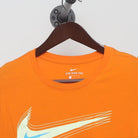 Close-up of the collar and tag on the Vintage 2010s Nike "Motion Swoosh" T-Shirt - M