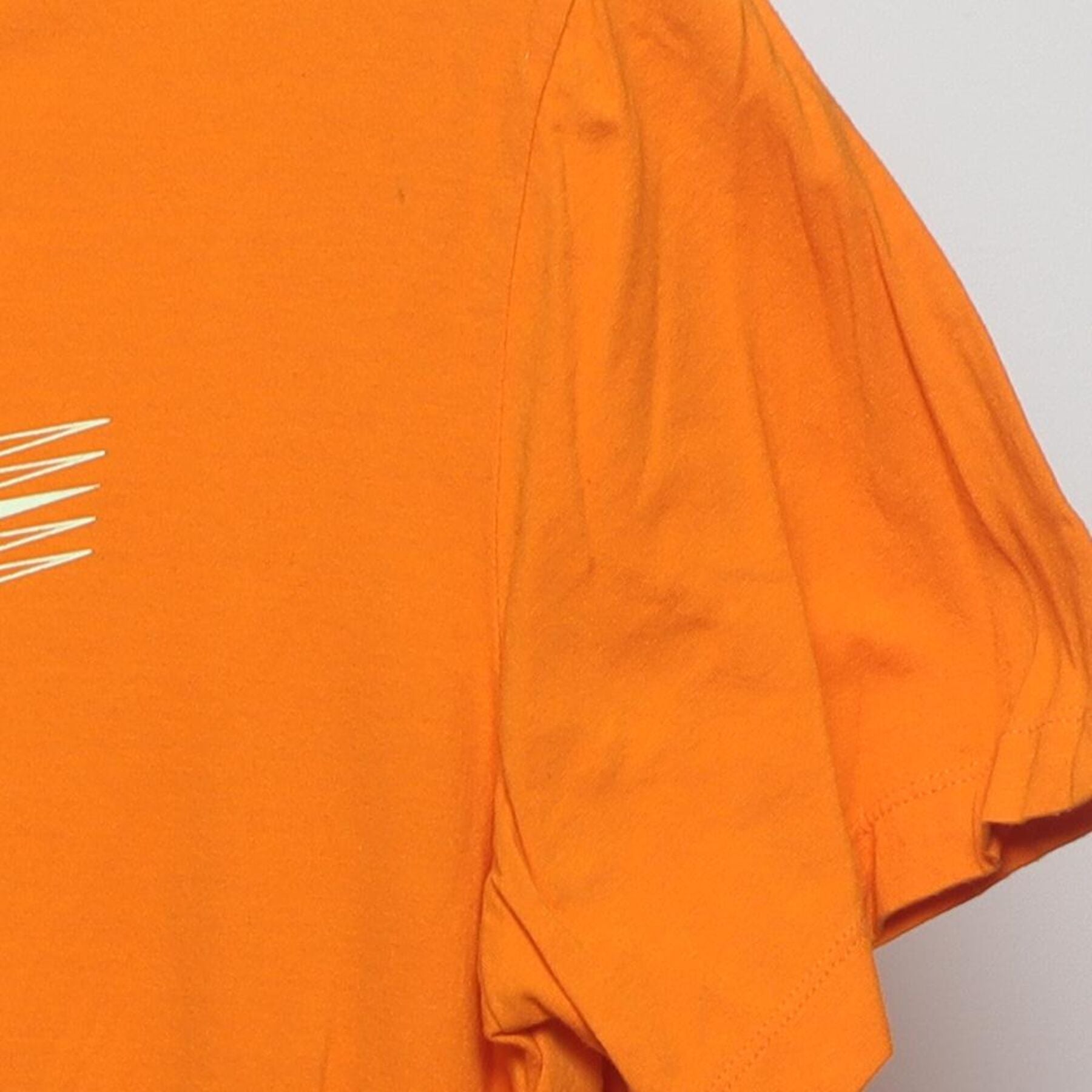 Close-up of the Right sleeve on the Vintage 2010s Nike "Motion Swoosh" T-Shirt - M