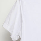 Close-up of the Left sleeve on the Vintage 2010s Nike "US Soccer One Nation One Team" T-Shirt - M