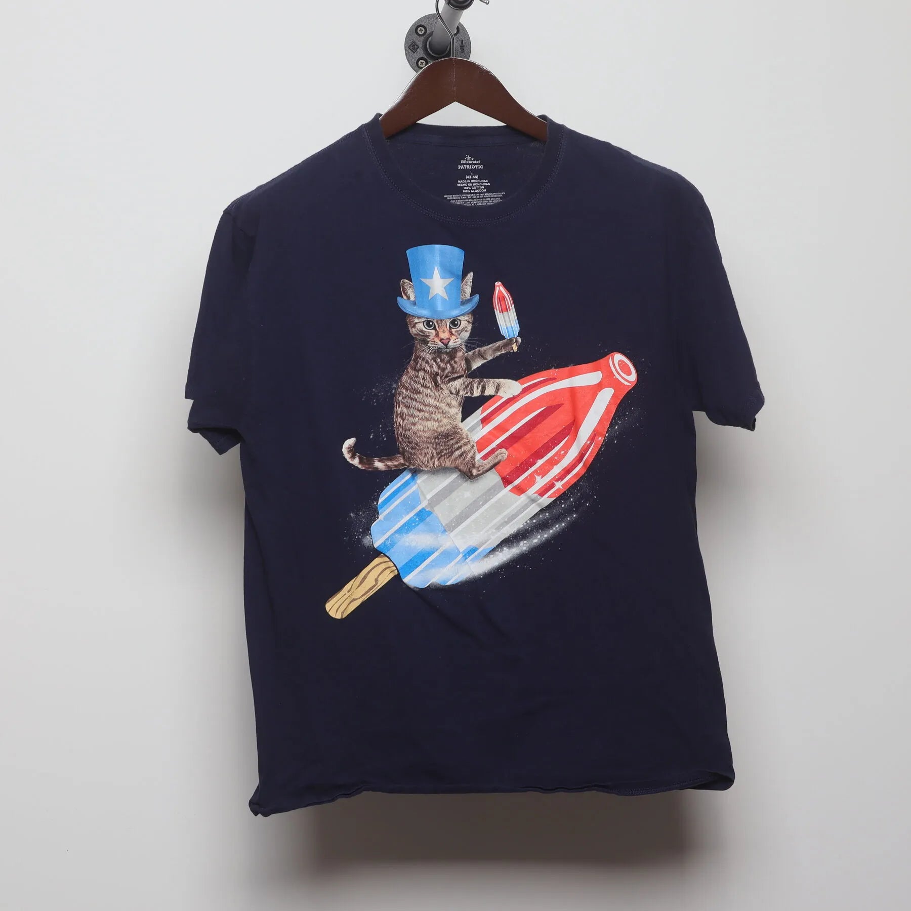 Front view of Vintage Y2K Celebrate! Patriotic "Cat Riding Rocket Pop" T-Shirt - M