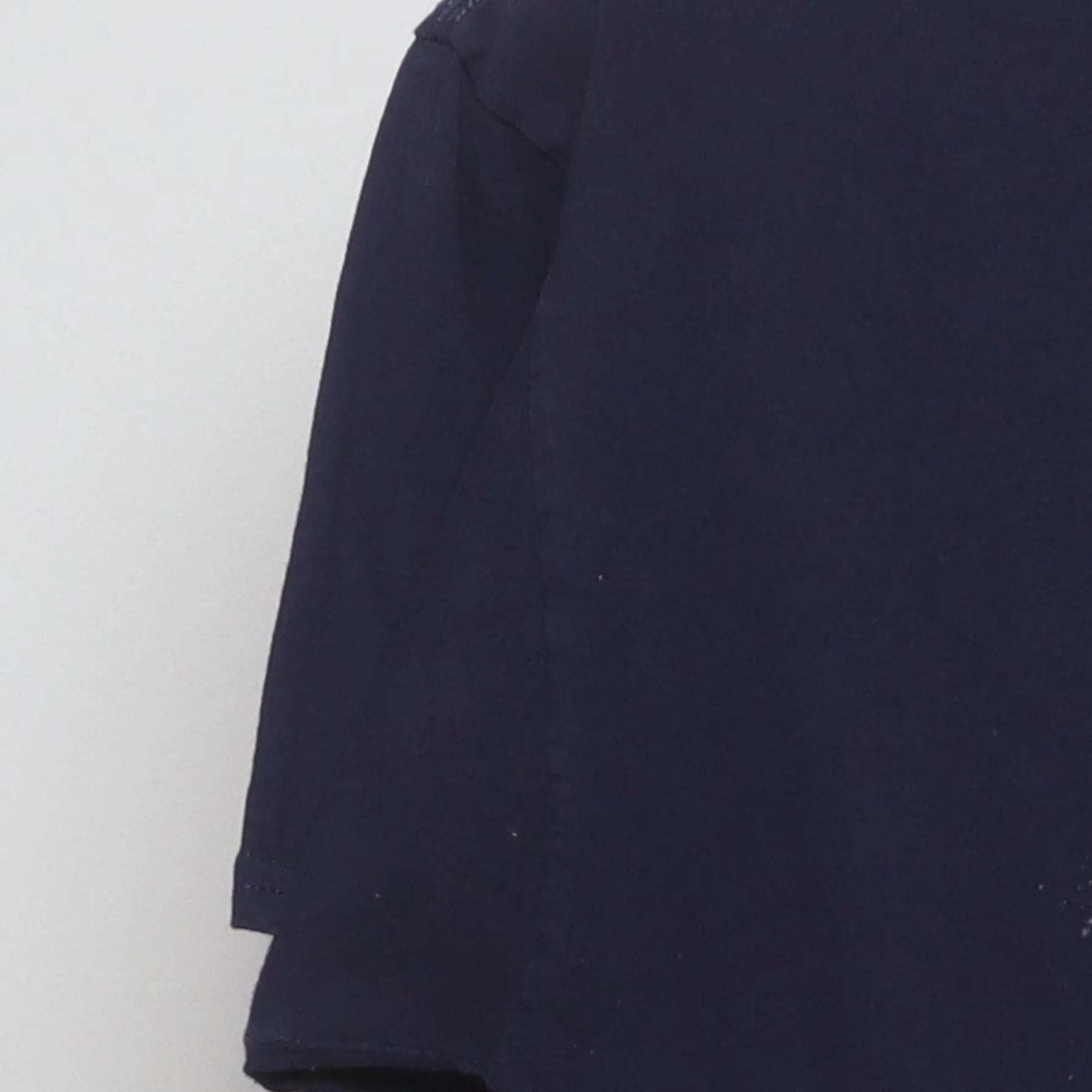 Close-up of the Left sleeve on the Vintage Y2K Celebrate! Patriotic "Cat Riding Rocket Pop" T-Shirt - M