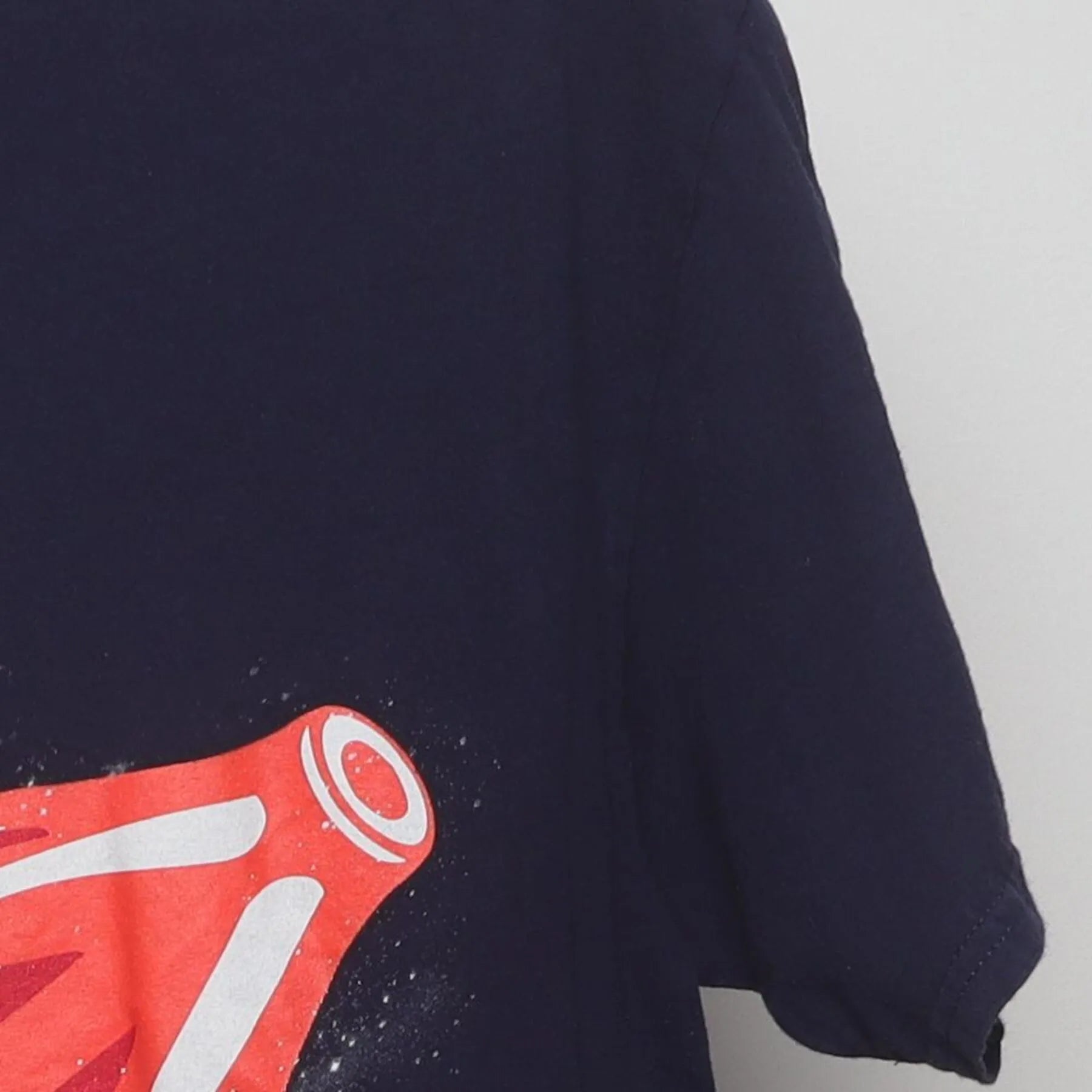 Close-up of the Right sleeve on the Vintage Y2K Celebrate! Patriotic "Cat Riding Rocket Pop" T-Shirt - M