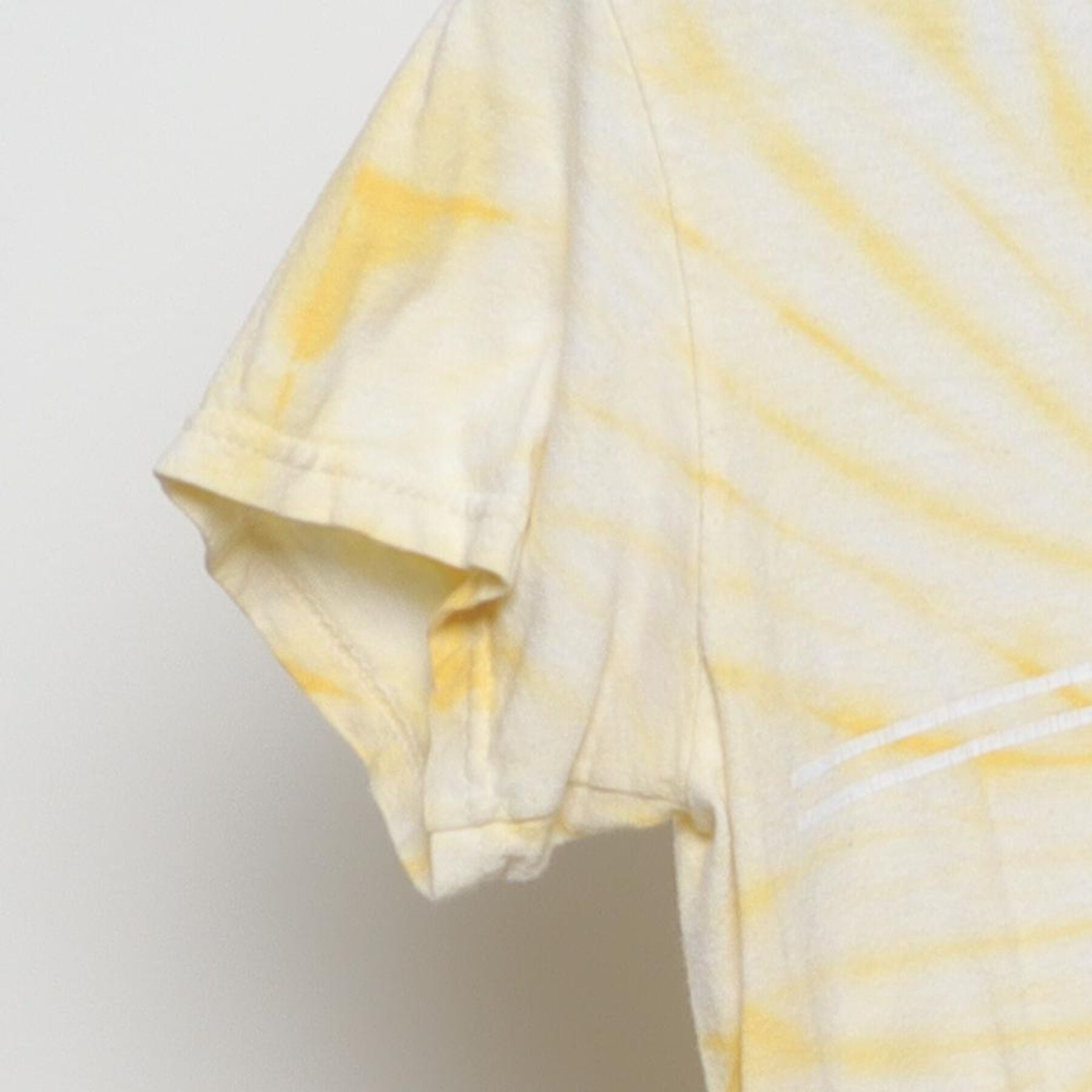 Close-up of the Left sleeve on the Vintage Y2K Santa Cruz Skateboards "Classic Dot Logo" Tie-Dye T-Shirt - S