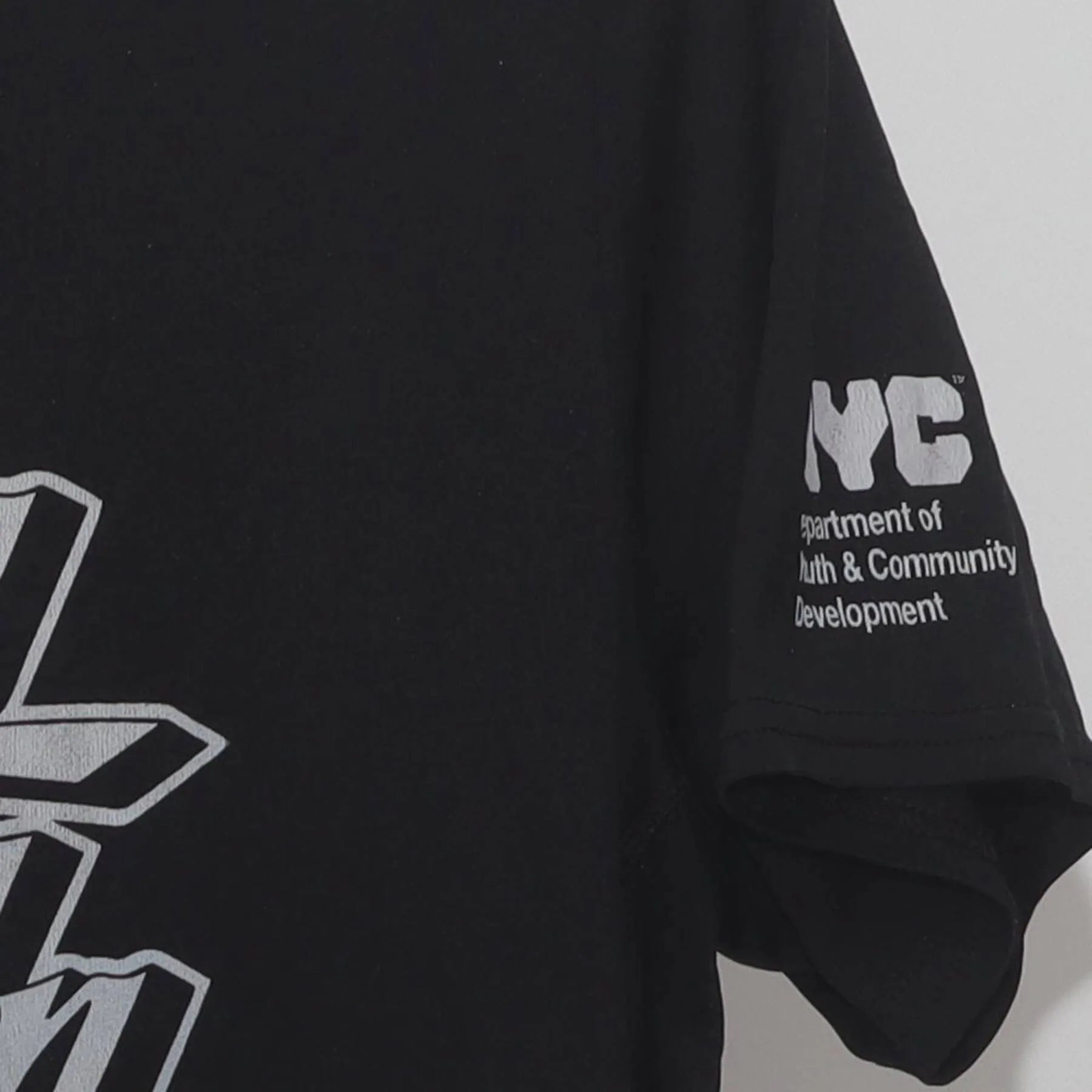 Close-up of the Right sleeve on the Vintage Y2K NYC DYCD "Step It Up" T-Shirt - M