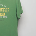 Close-up of the sleeve on the Vintage 00s John Deere Farm Supply Graphic T-Shirt L
