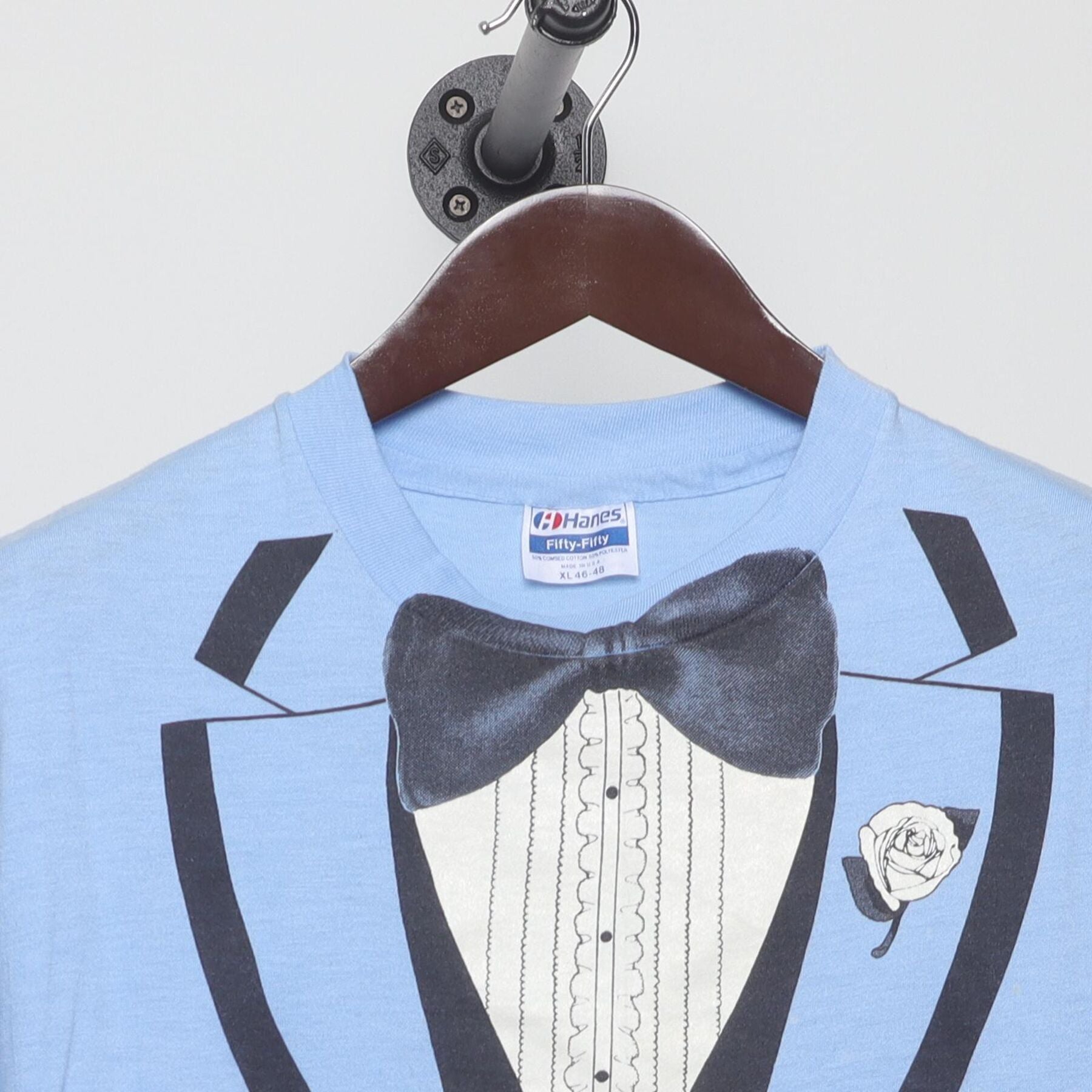Close-up of the collar and tag on the Vintage 1980s Roach "Tuxedo" T-Shirt - M