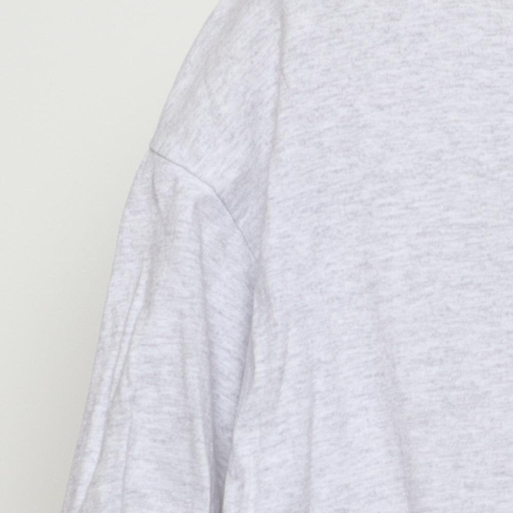 Close-up of the single stitch sleeve on the Vintage 1990s Cherokee "Carved Figures" T-Shirt - L