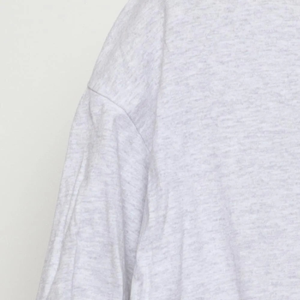 Close-up of the single stitch sleeve on the Vintage 1990s Cherokee "Carved Figures" T-Shirt - L