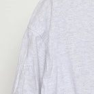 Close-up of the single stitch sleeve on the Vintage 1990s Cherokee "Carved Figures" T-Shirt - L