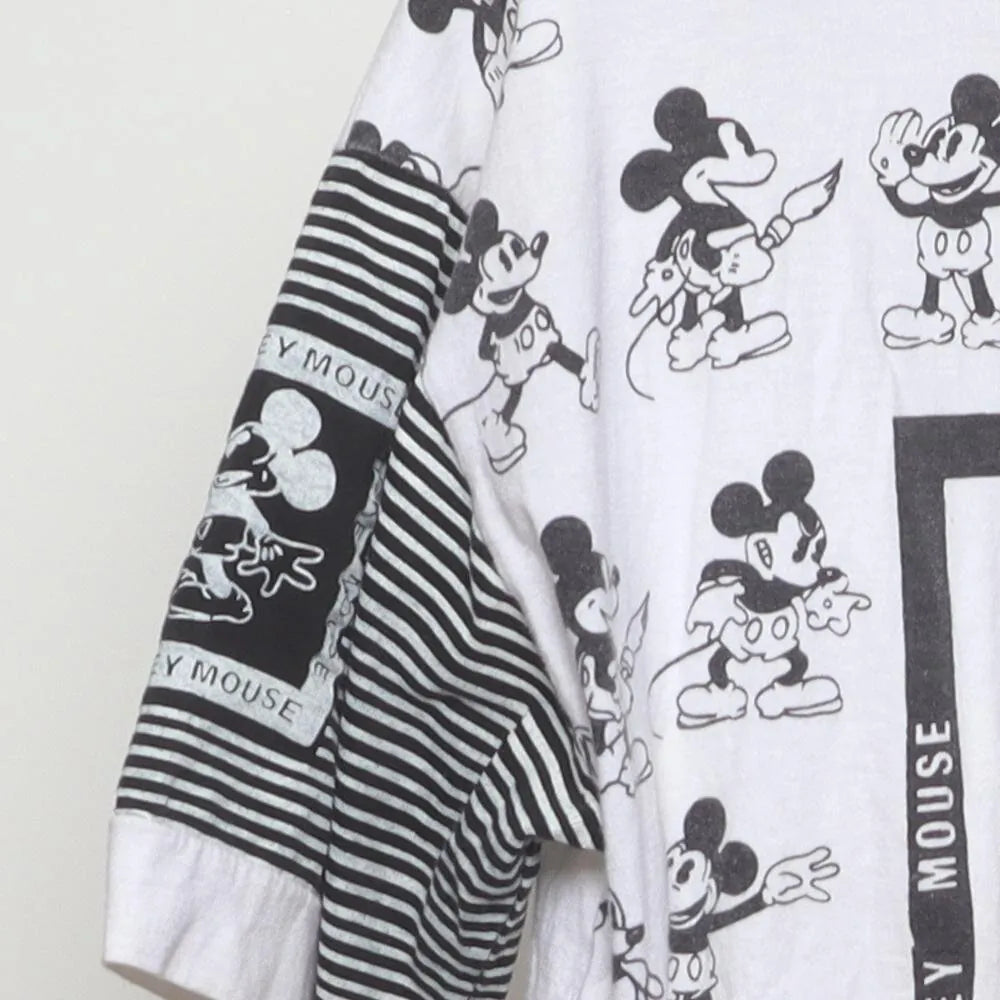Close-up of the sleeve on the Vintage 1990s Disney "Mickey Mouse All-Over Print" T-Shirt - L