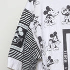 Close-up of the sleeve on the Vintage 1990s Disney "Mickey Mouse All-Over Print" T-Shirt - L