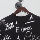 Close-up of the collar and tag on the Vintage 1990s Graffiti Art "Chaos & Peace" All Over Print T-Shirt - XXL