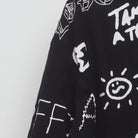 Close-up of the sleeve on the Vintage 1990s Graffiti Art "Chaos & Peace" All Over Print T-Shirt - XXL