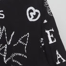 Close-up of the sleeve on the Vintage 1990s Graffiti Art "Chaos & Peace" All Over Print T-Shirt - XXL