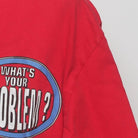 Close-up of the sleeve on the Vintage 1990s Looney Tunes "What's Your Pwoblem?" T-Shirt - L