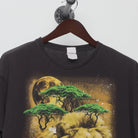 Close-up of the collar and tag on the Vintage 2000s Cosmic Lion Nature Graphic T-Shirt L