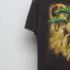 Close-up of the sleeve on the Vintage 2000s Cosmic Lion Nature Graphic T-Shirt L