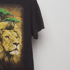 Close-up of the sleeve on the Vintage 2000s Cosmic Lion Nature Graphic T-Shirt L