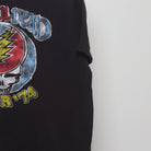 Close-up of the sleeve on the Vintage 2000s Grateful Dead Tour '74 Graphic Tee L