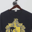 Close-up of the collar and tag on the Vintage 2000s Harry Potter Hufflepuff Crest T-Shirt L