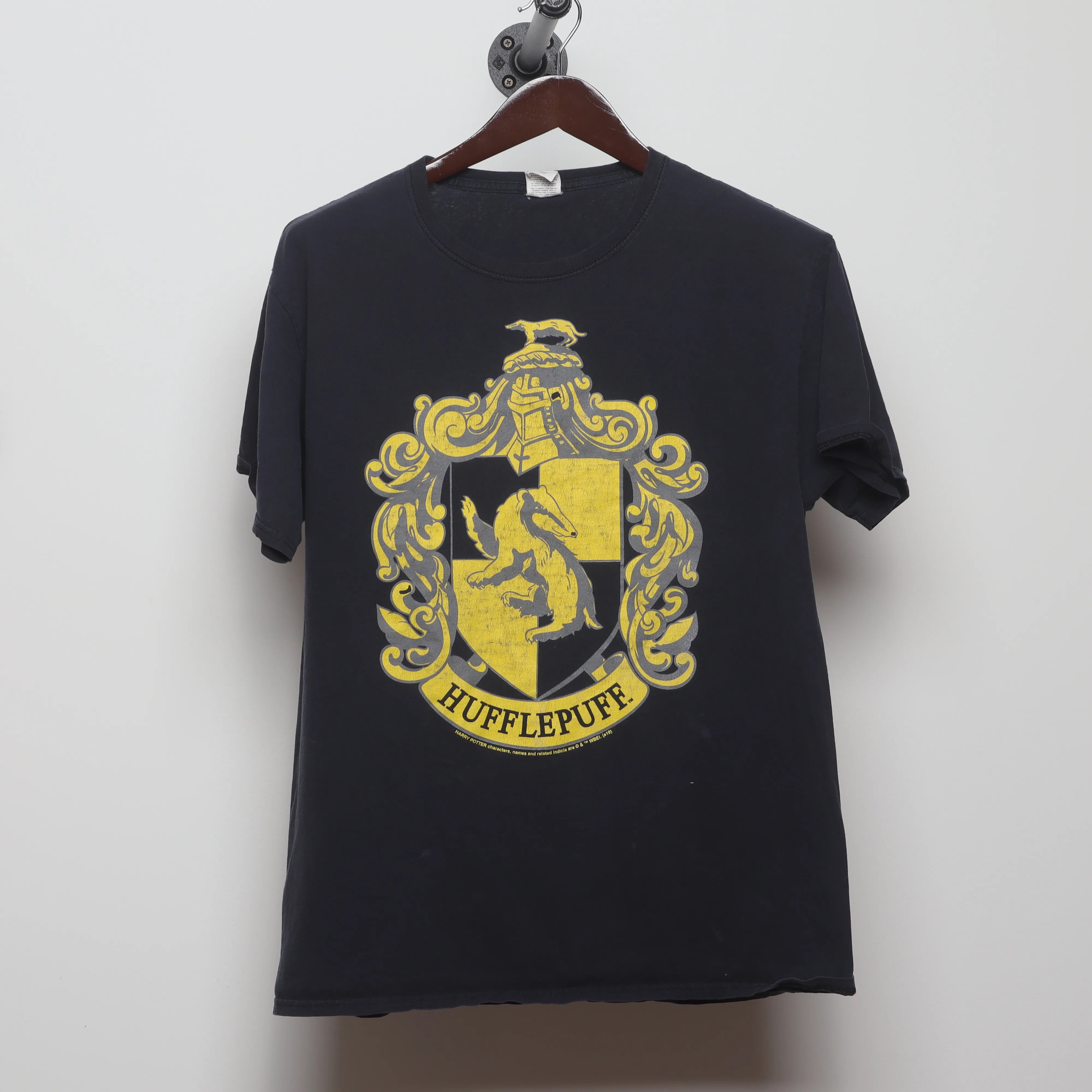 Front view of Vintage 2000s Harry Potter Hufflepuff Crest T-Shirt L