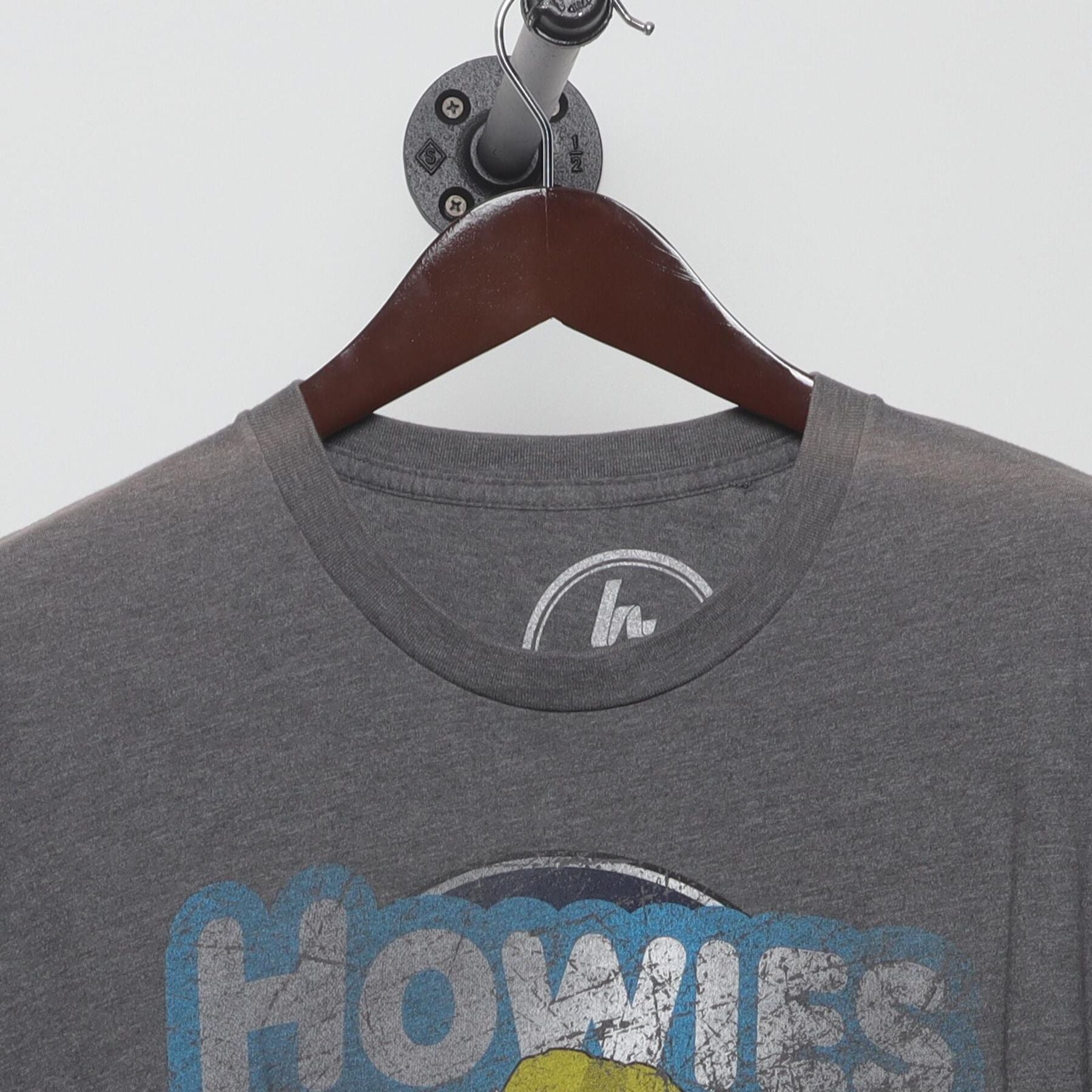 Close-up of the collar and tag on the Vintage Y2K Homage x Howies Hockey Tape "Mascot Logo" T-Shirt - L