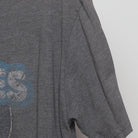 Close-up of the Right sleeve on the Vintage Y2K Homage x Howies Hockey Tape "Mascot Logo" T-Shirt - L