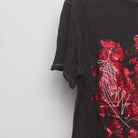 Close-up of the sleeve on the Vintage 2000s Marc Ecko Foil Eagle T-Shirt XL