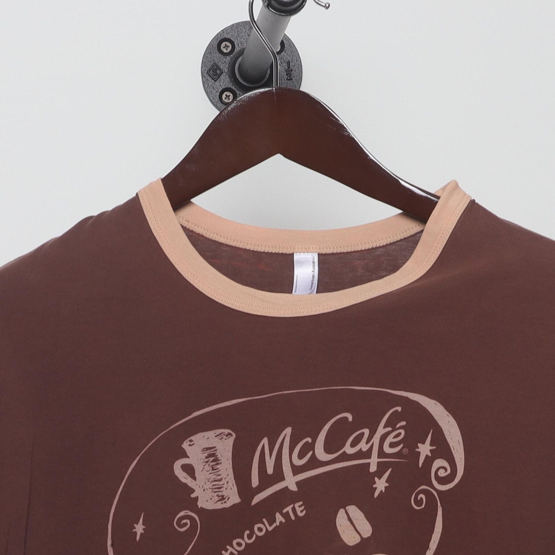 Close-up of the collar and tag on the Vintage Y2K McCafé "Coffee Menu" T-Shirt - M