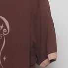 Close-up of the Right sleeve on the Vintage Y2K McCafé "Coffee Menu" T-Shirt - M