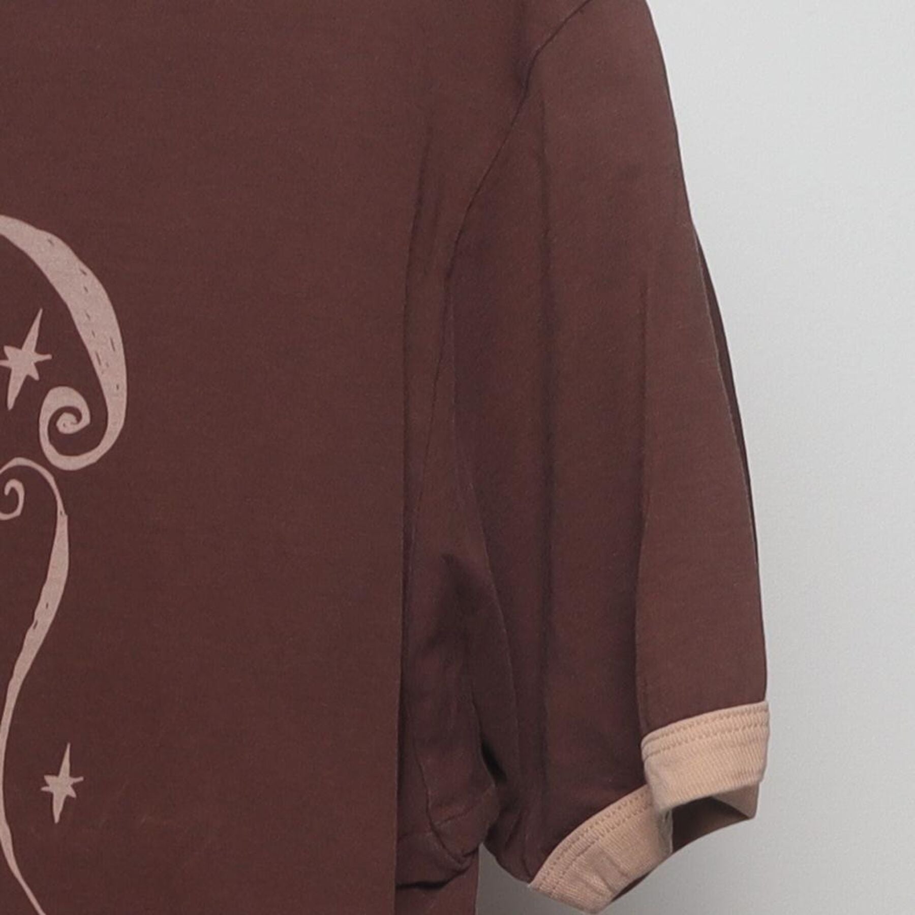 Close-up of the Right sleeve on the Vintage Y2K McCafé "Coffee Menu" T-Shirt - M