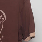Close-up of the Right sleeve on the Vintage Y2K McCafé "Coffee Menu" T-Shirt - M