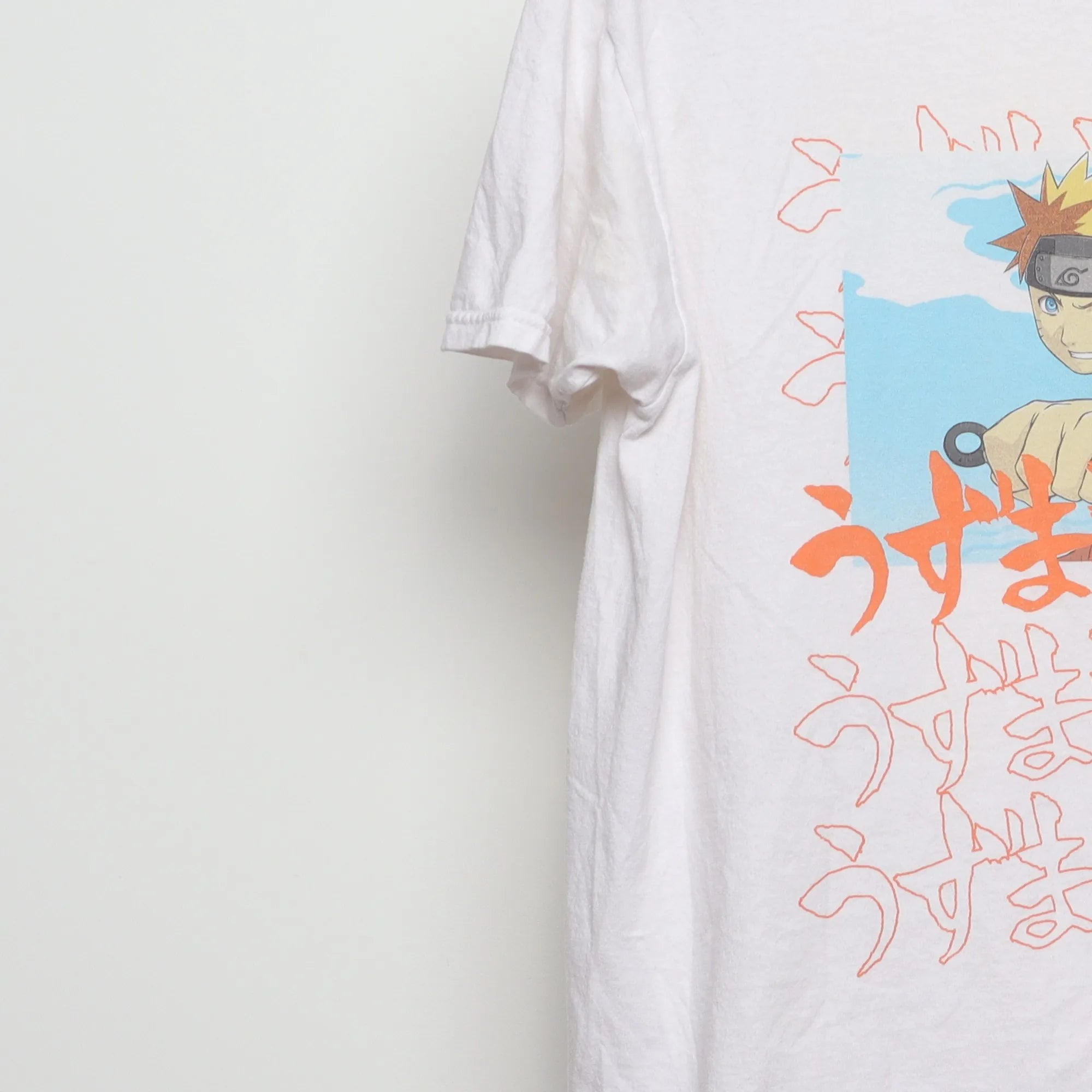 Close-up of the sleeve on the Vintage 2000s Naruto Shippuden Anime T-Shirt M