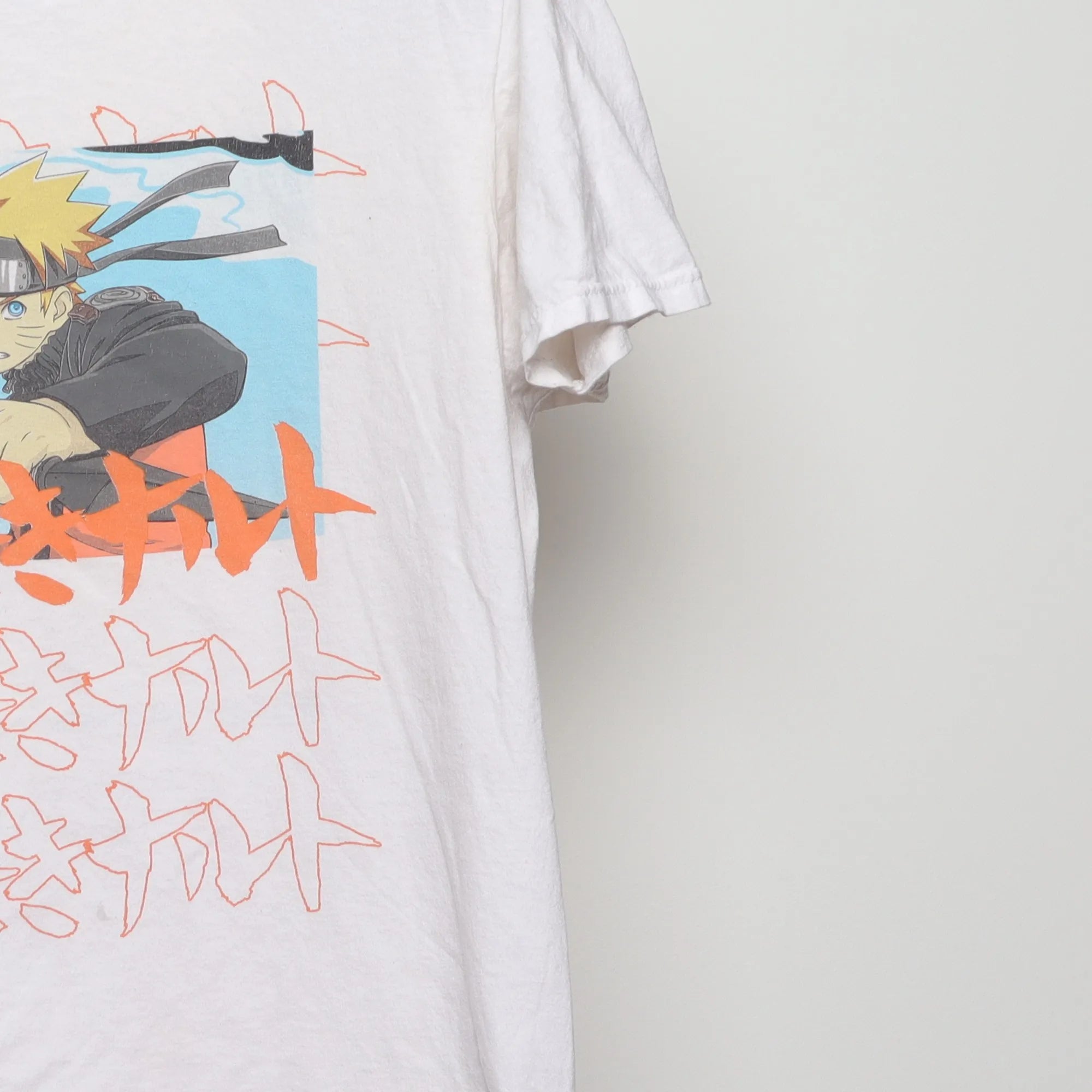 Close-up of the sleeve on the Vintage 2000s Naruto Shippuden Anime T-Shirt M
