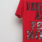 Close-up of the sleeve on the Vintage 2000s Respect All Fear None Graphic Tee S