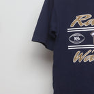 Close-up of the sleeve on the Vintage 2000s St. Louis Rams Kurt Warner T-Shirt M