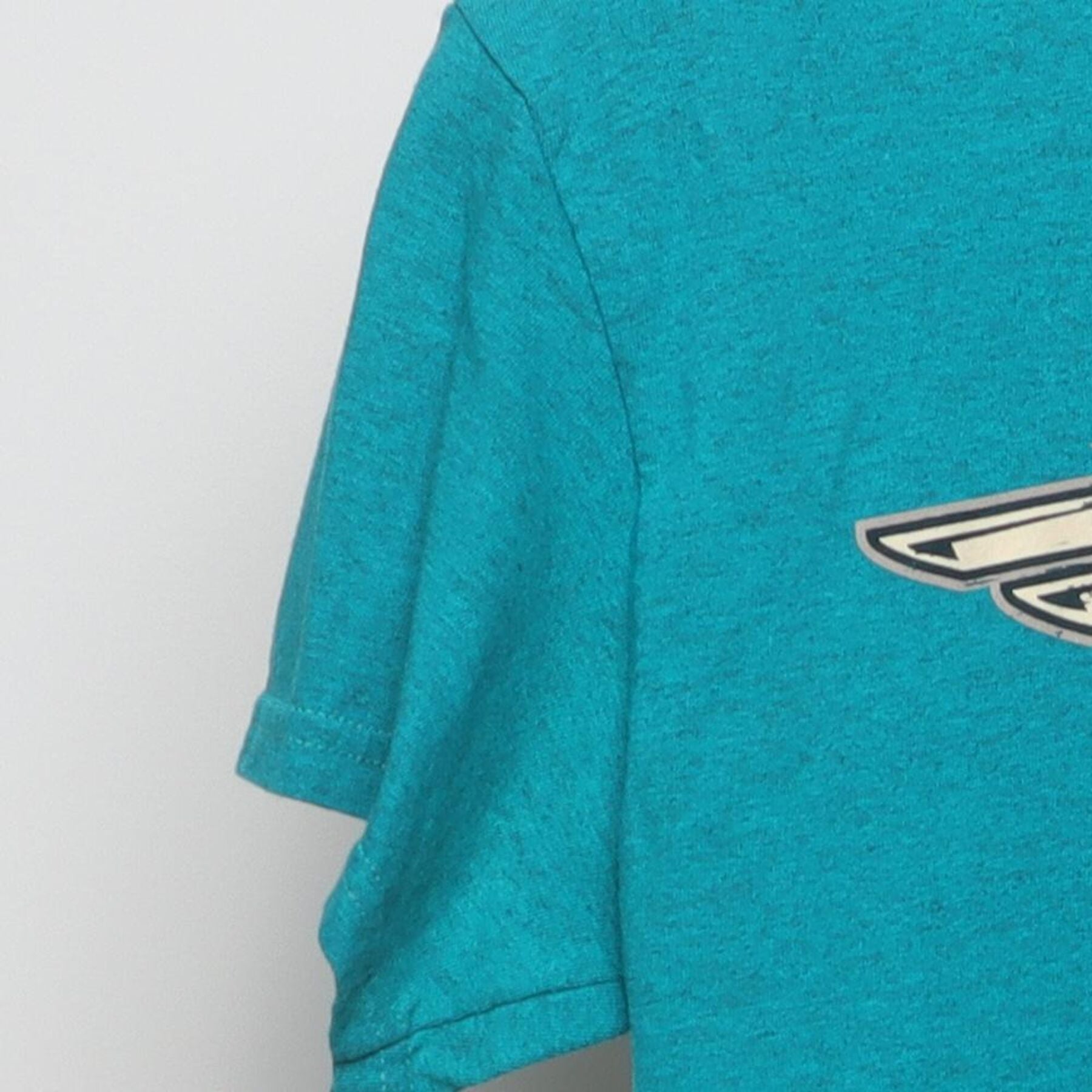 Close-up of the Left sleeve on the Vintage 1980s Harley-Davidson "World Famous Motorcycles" T-Shirt - S