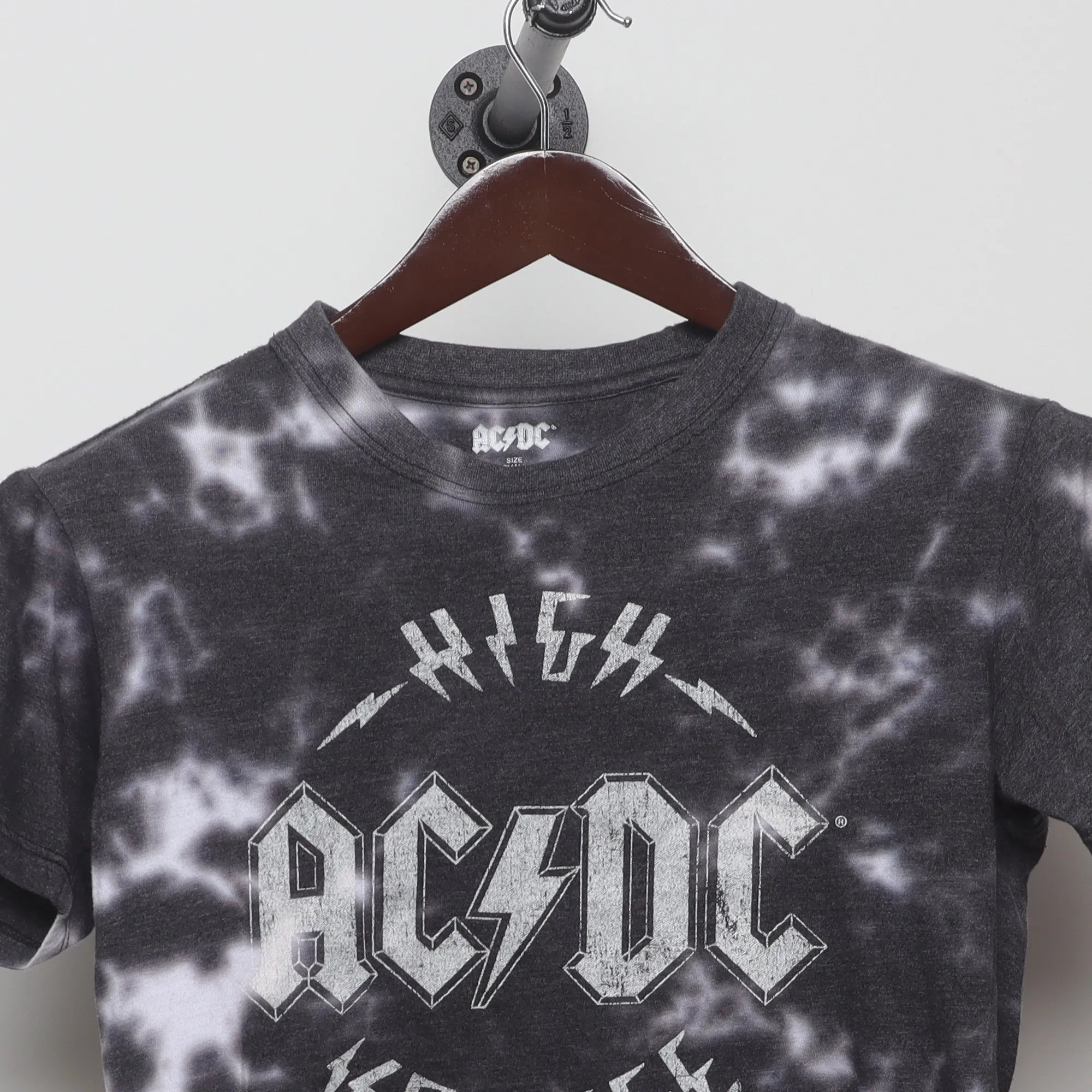 Close-up of the collar and tag on the Vintage 2010s AC/DC High Voltage Tie-Dye Tee S