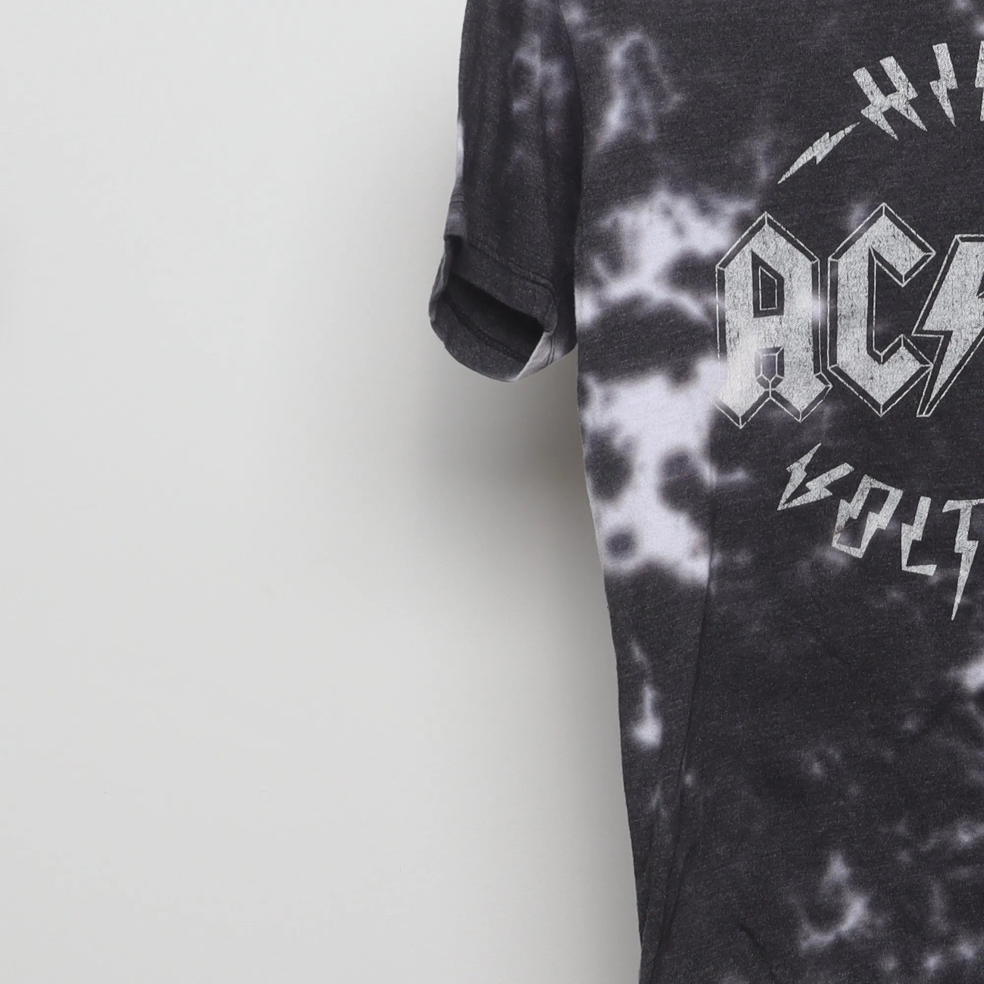 Close-up of the sleeve on the Vintage 2010s AC/DC High Voltage Tie-Dye Tee S