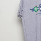 Close-up of the sleeve on the Vintage 2010s Champions Cup Soccer Match T-Shirt M