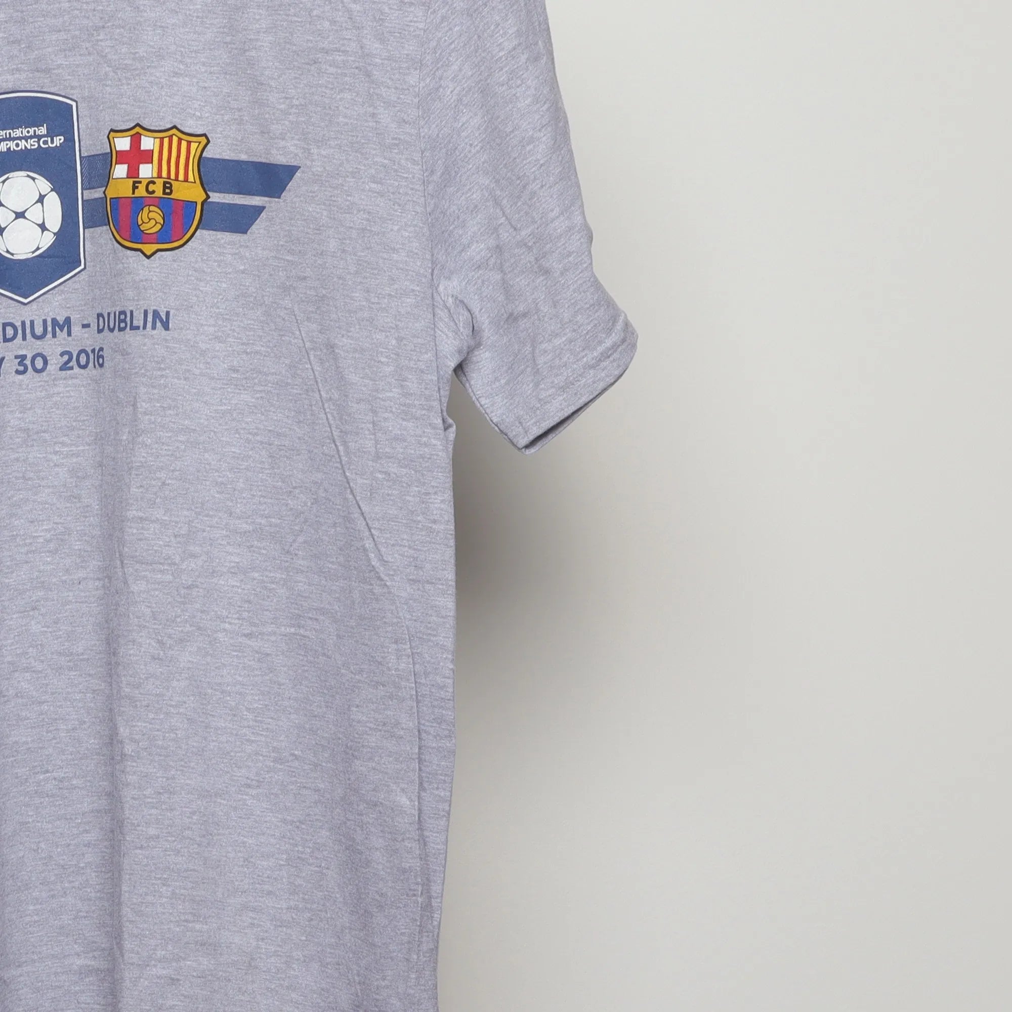 Close-up of the sleeve on the Vintage 2010s Champions Cup Soccer Match T-Shirt M