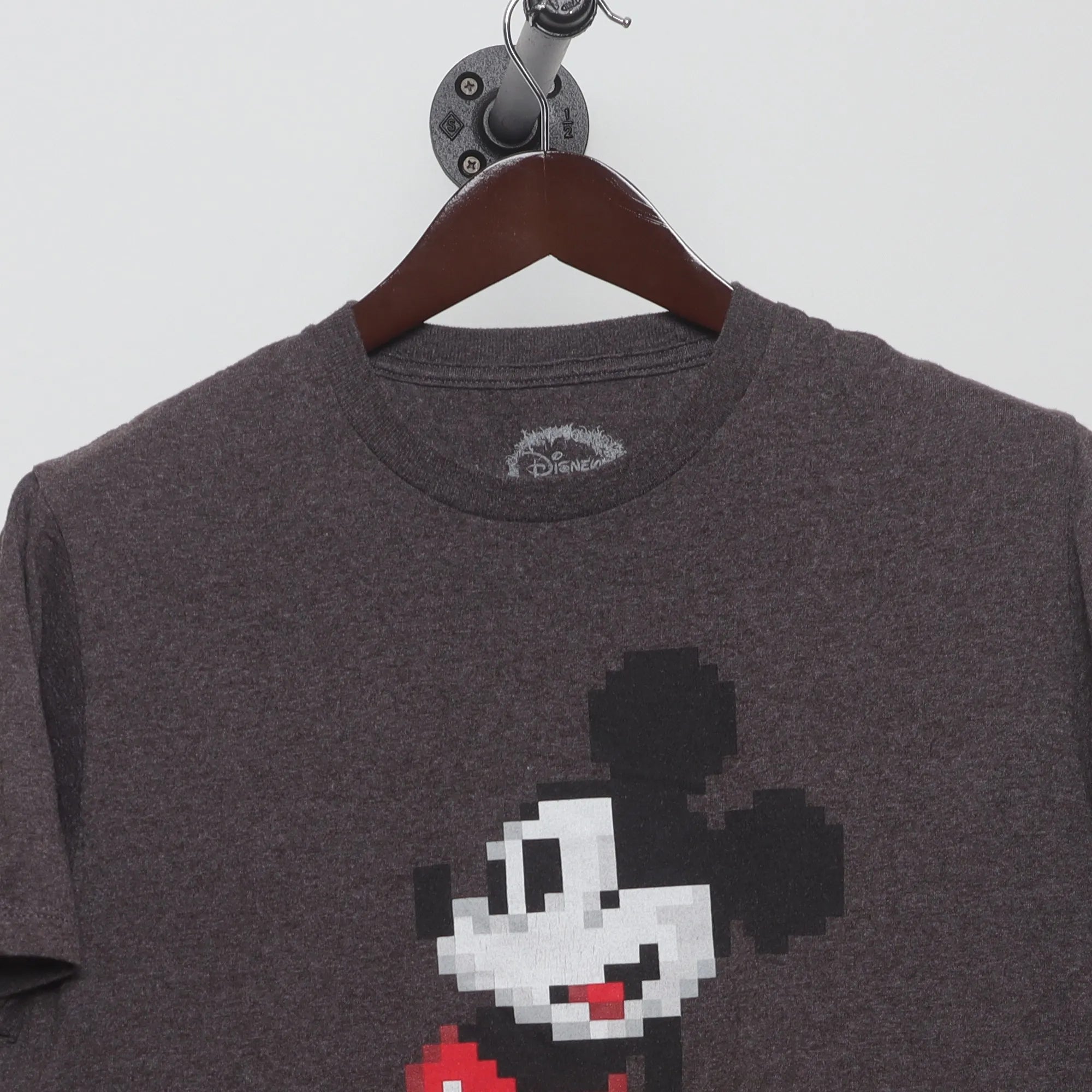 Close-up of the collar and tag on the Vintage 2010s Disney 8-Bit Mickey Mouse T-Shirt L