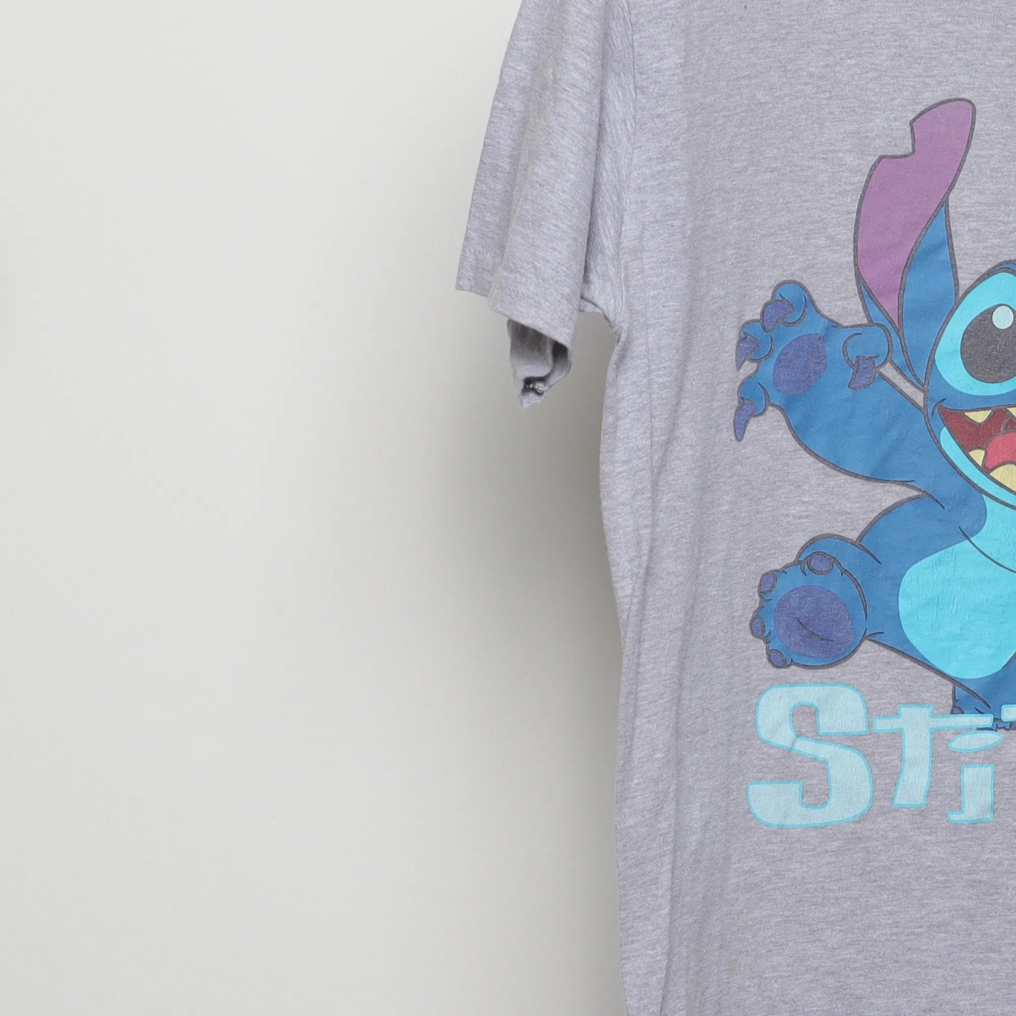 Close-up of the sleeve on the Vintage 2010s Disney Stitch Graphic T-Shirt S