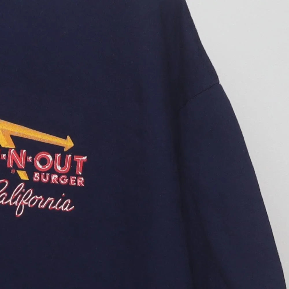 Close-up of the sleeve on the Vintage 2010s In-N-Out Burger "Classic Cars Sunset" T-Shirt - XL