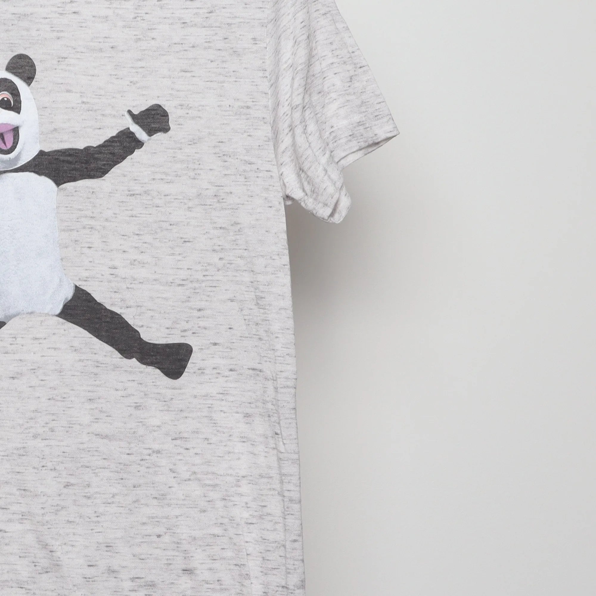 Close-up of the sleeve on the Vintage 2010s Jimmy Fallon Hashtag Panda T-Shirt S